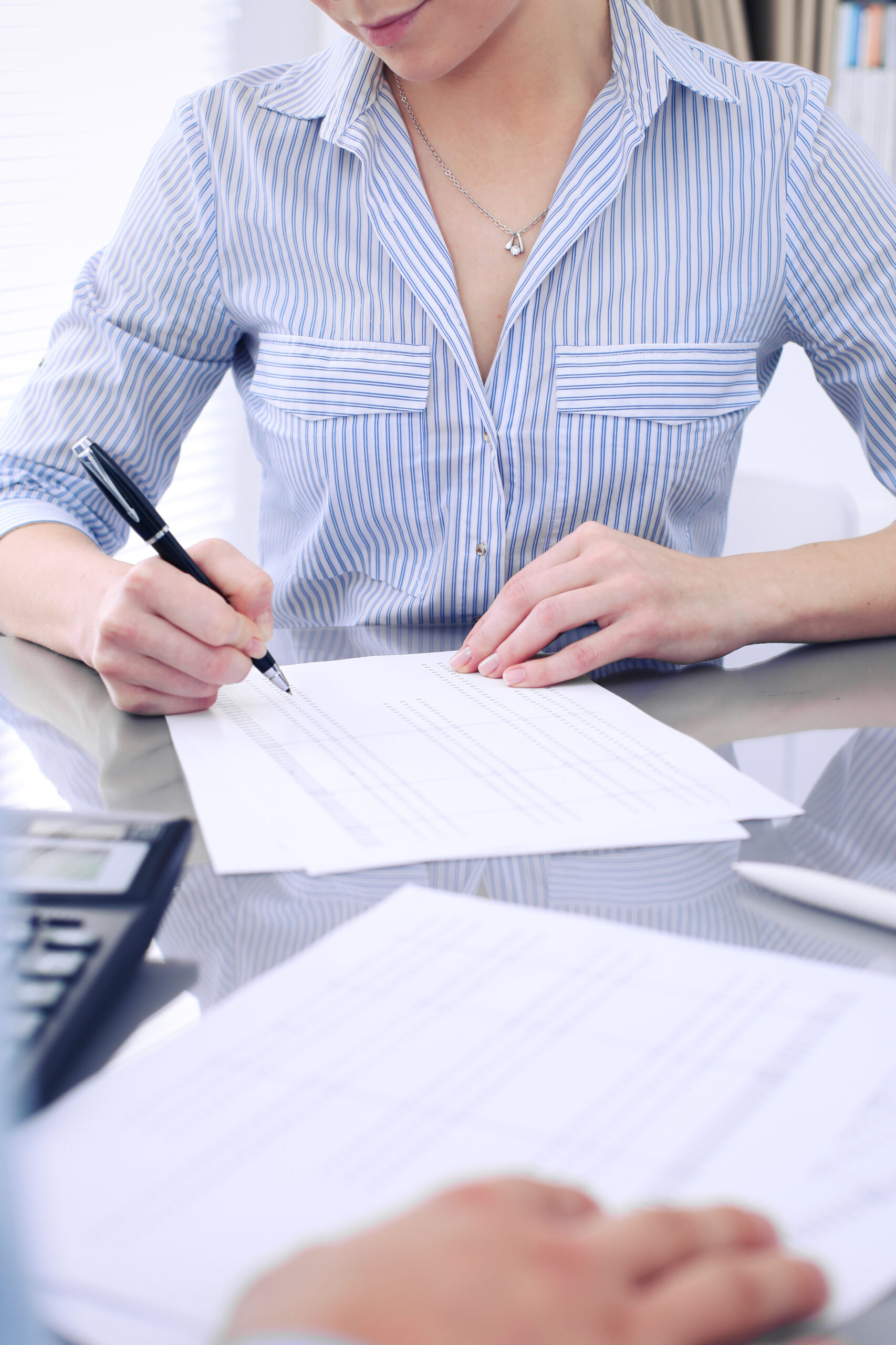 Explore the vibrant scene of a Ferris wheel next to a historic brick building in Łódź, Poland.